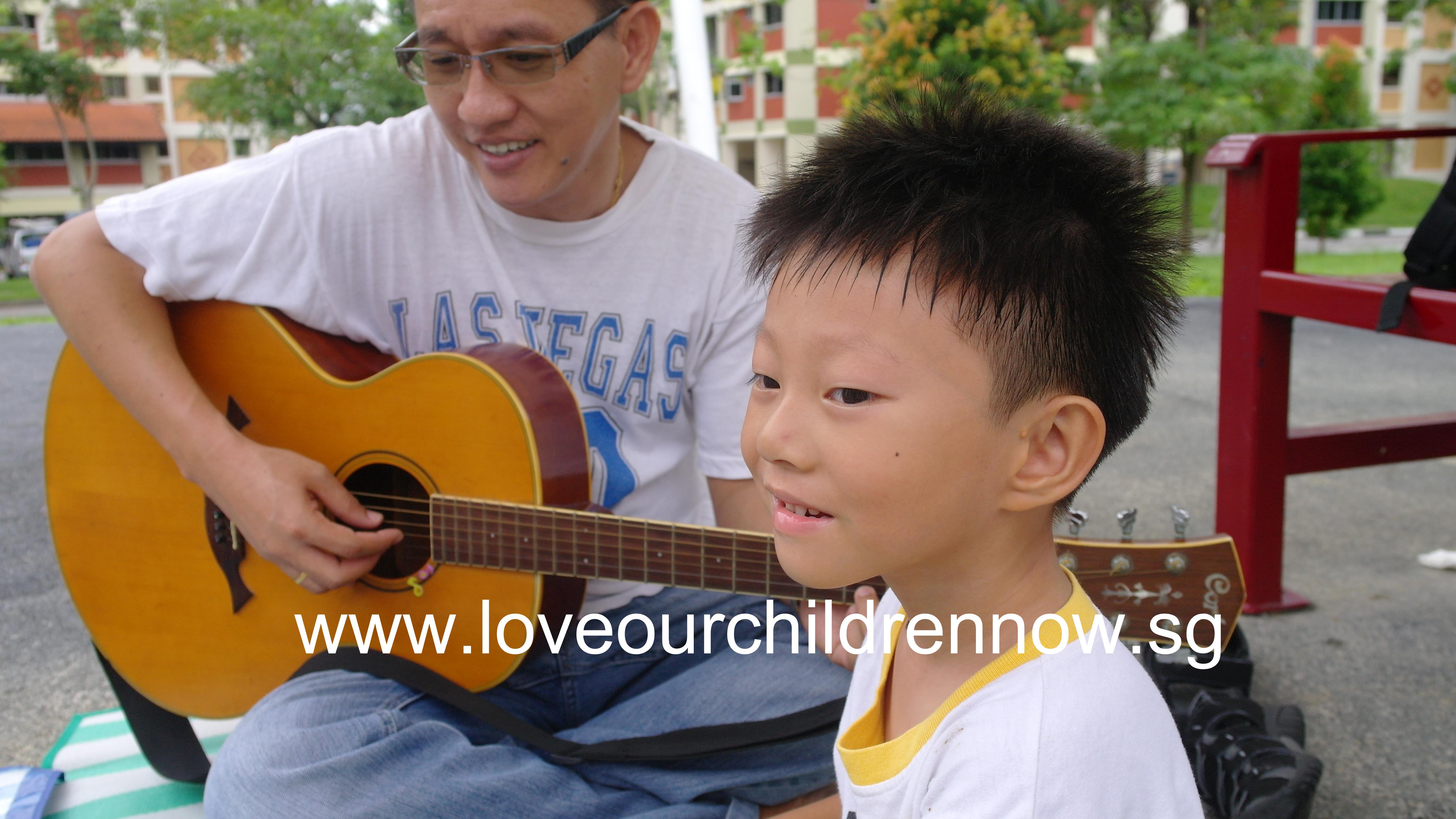 This is one of our family devotion times :)Daddy is playing the guitar and Samuel is enjoying it :)